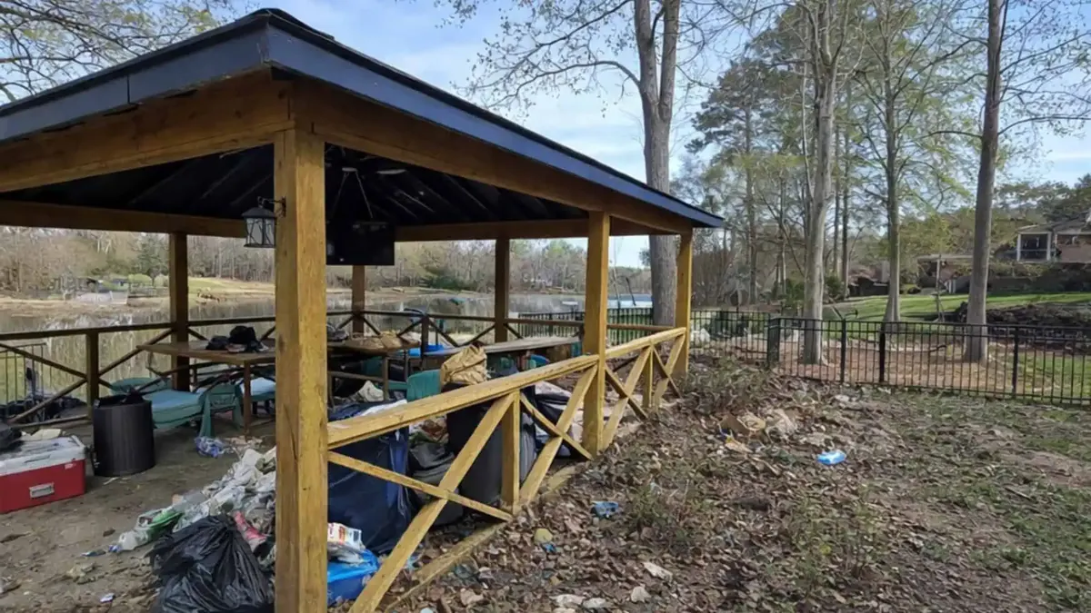 Before: overgrown pavilion area covered in debris
